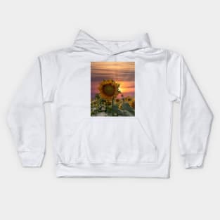 Breathtaking sunset over a sunflower field Kids Hoodie